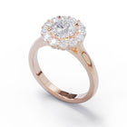 Rose gold ring with a diamond cluster on a white background