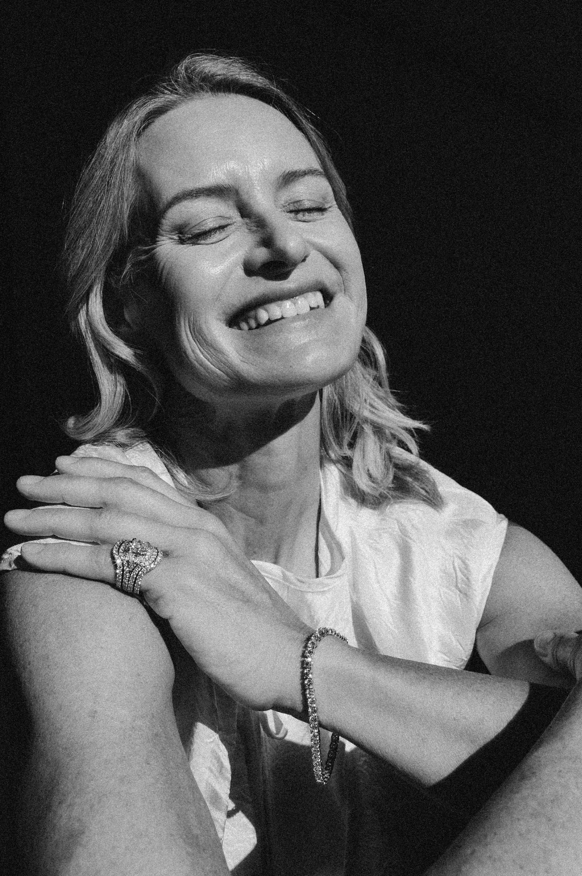 woman wearing Tennis Bracelet and Three Ring Diamond Set 