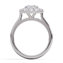 Diamond ring with a central gemstone and smaller stones on a white background