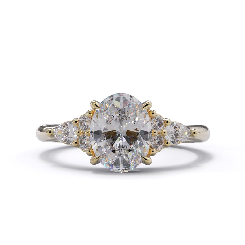 A yellow gold engagement ring featuring a large central diamond with 3 smaller diamonds on each side, set against a white background.