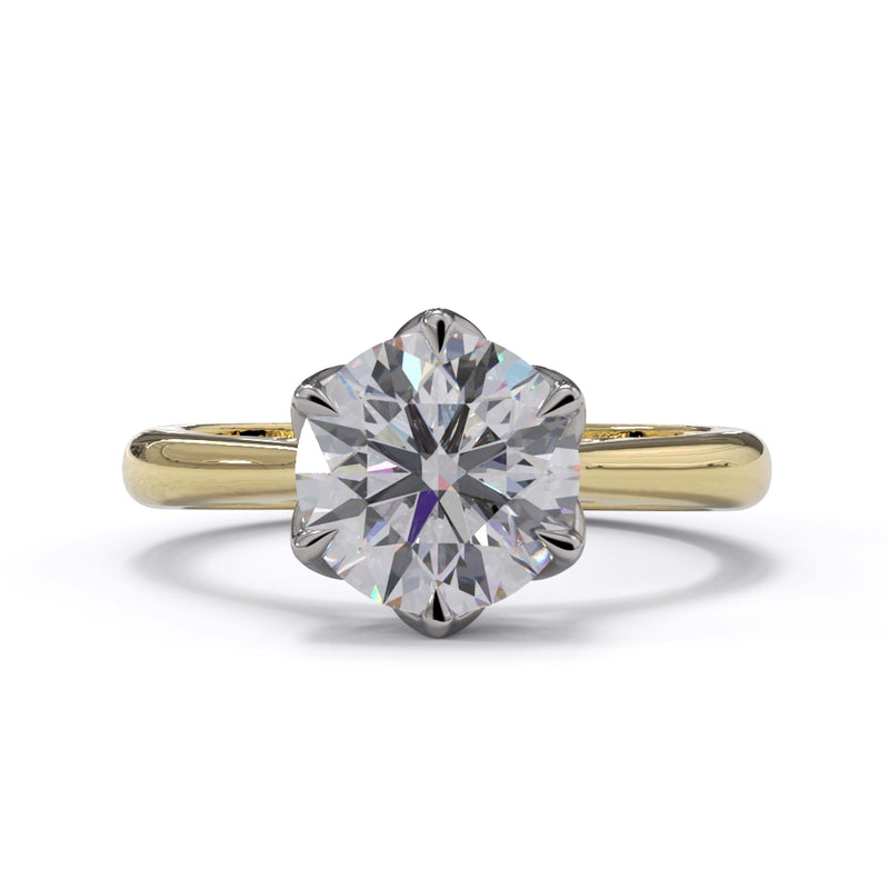 A yellow gold ring with a large central diamond and smaller diamonds on the band