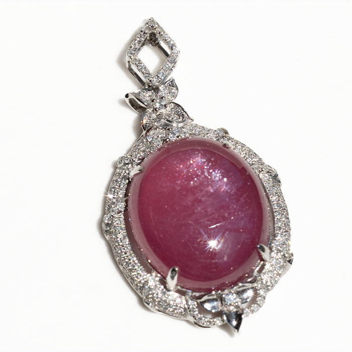 pendant with cabochon ruby and micro-halo diamonds 