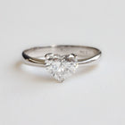Heart-shaped diamond ring on a light gray background. Handmade in Auckland, New Zealand by our award winning team 