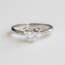 Heart-shaped diamond ring on a light gray background. Handmade in Auckland, New Zealand by our award winning team 