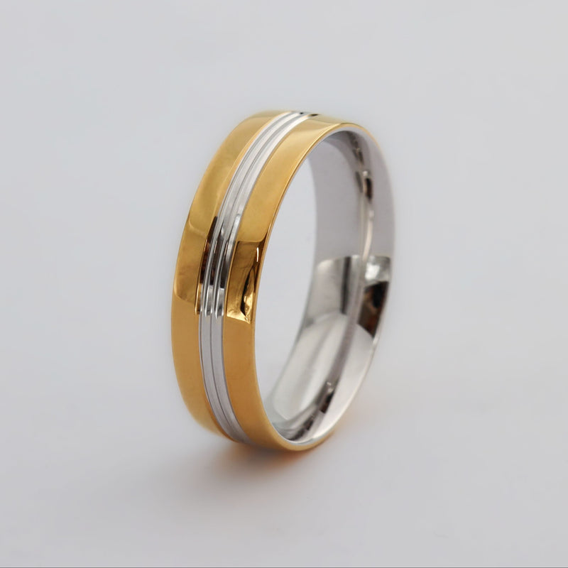 Thick two-toned men's wedding ring jewellery. Yellow gold with a white gold in the middle. 