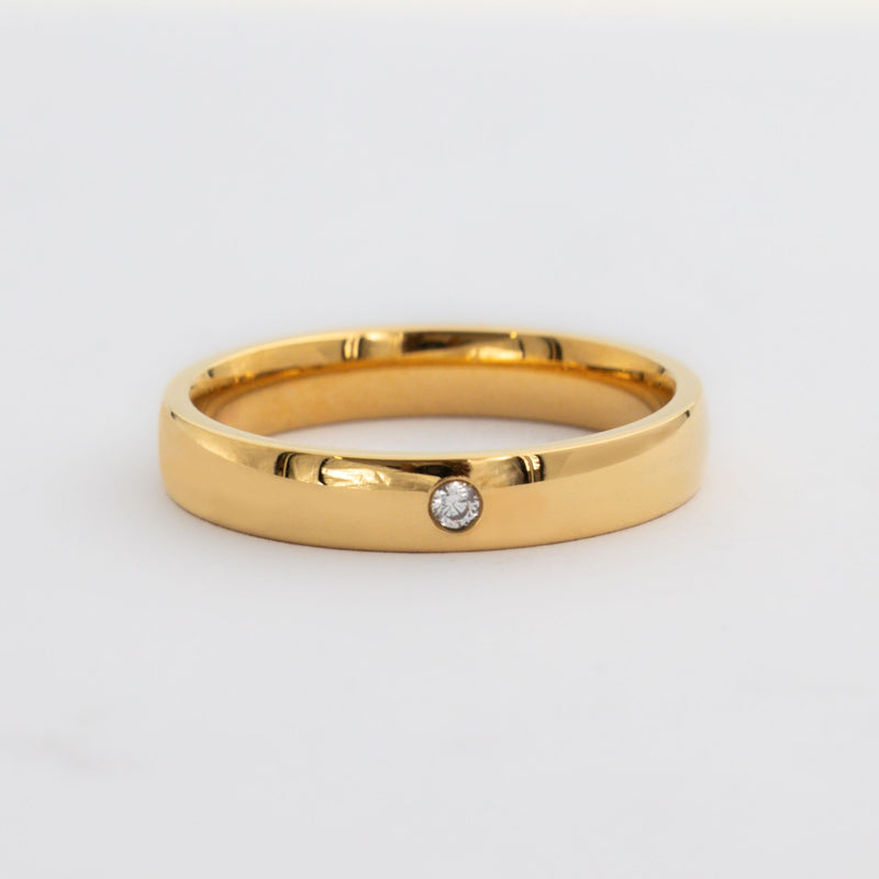 Mens gold wedding band with single diamond. 