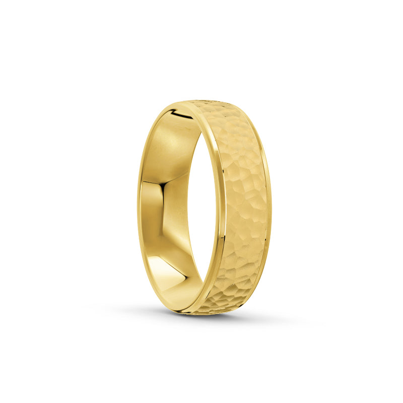 Yellow-gold men's wedding ring with a hammered finish on a white background. By Meaden Master Jewellers. Award-winning team of Jewellers, based in Auckland, New Zealand.