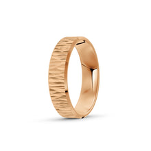 Rose gold ring with a textured band on a white background. By Meaden Master Jewellers. Award-winning team of Jewellers, based in Auckland, New Zealand.