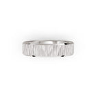 Platinum or white-gold men's wedding ring with a textured band on a white background. By Meaden Master Jewellers. Award-winning team of Jewellers, based in Auckland, New Zealand.