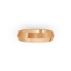 Rose-gold men's wedding ring with a polished finish on a white background. By Meaden Master Jewellers. Award-winning team of Jewellers, based in Auckland, New Zealand.