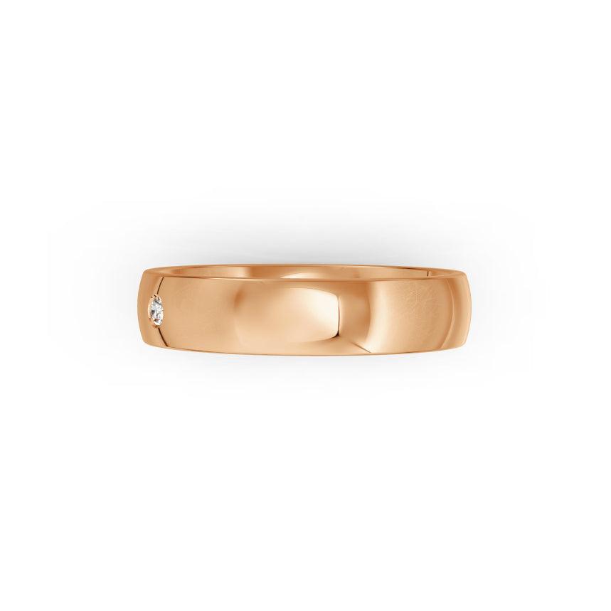 Rose-gold wedding ring with small diamond on a white background. By Meaden Master Jewellers. Award-winning team of Jewellers, based in Auckland, New Zealand.