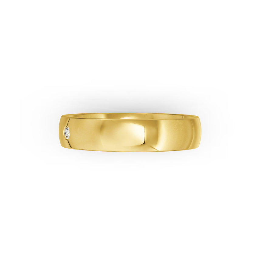 Yellow-gold wedding ring with small diamond on a white background. By Meaden Master Jewellers. Award-winning team of Jewellers, based in Auckland, New Zealand.