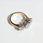 Gold emgagement ring with three diamonds on a white background. Made in Aucjkland, New Zealand.
