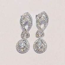 Conflict free Diamond dress earrings made by Master Jeweller