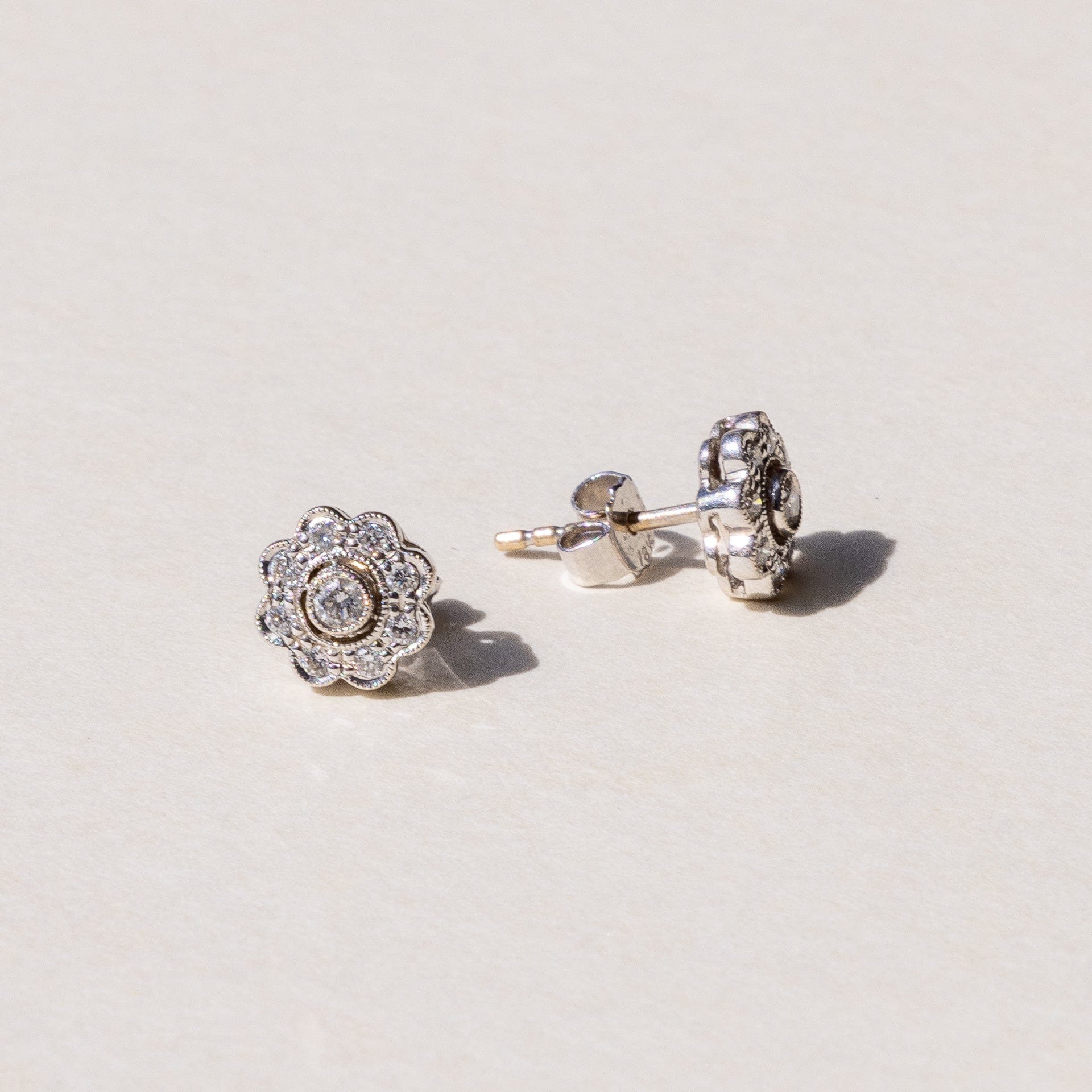 luxury floral design diamond studs handcrafted by our artisans at our on site workshop 