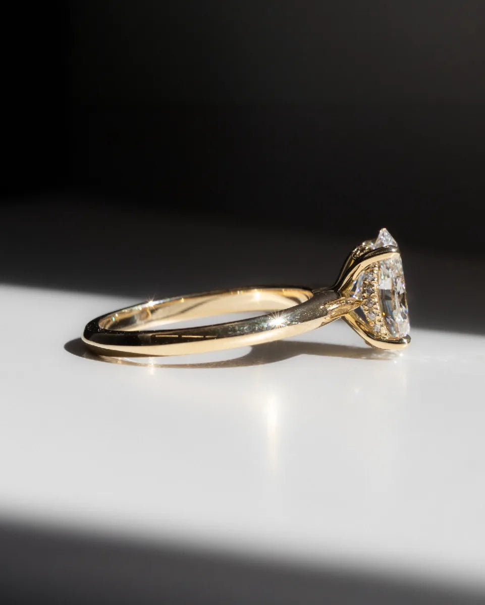 A solitaire on a fine yellow gold band