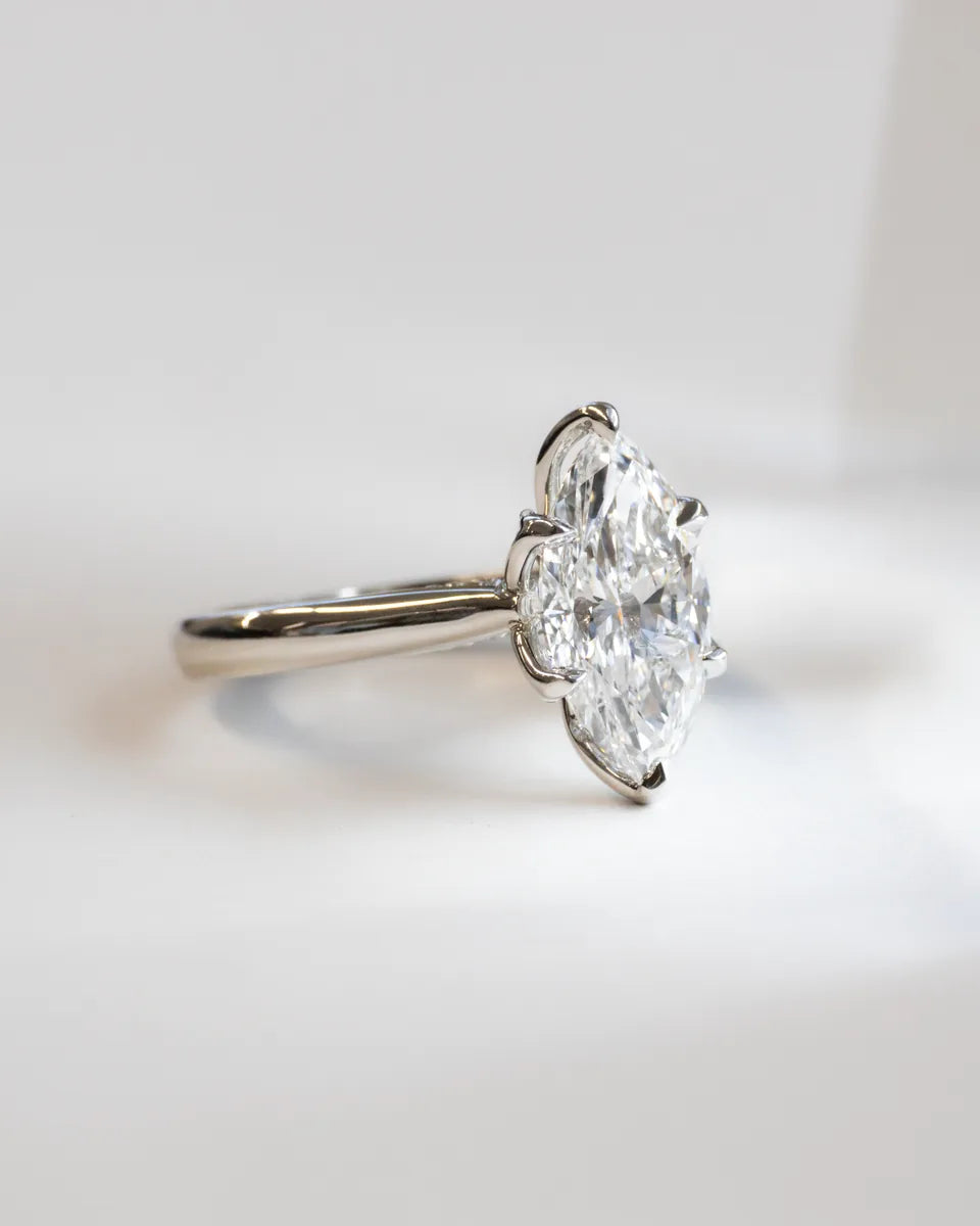 A marquise solitaire in white gold