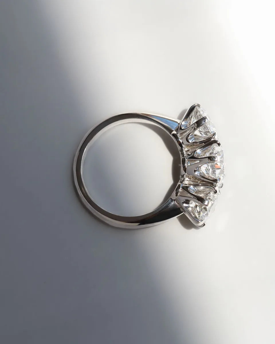 A round three stone in platinum