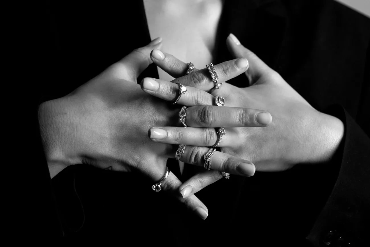 Rings made for six different people, worn together