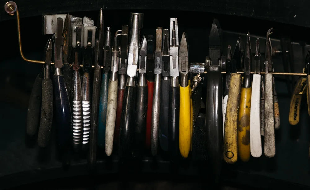 A jeweller's hand tools on the workshop rack
